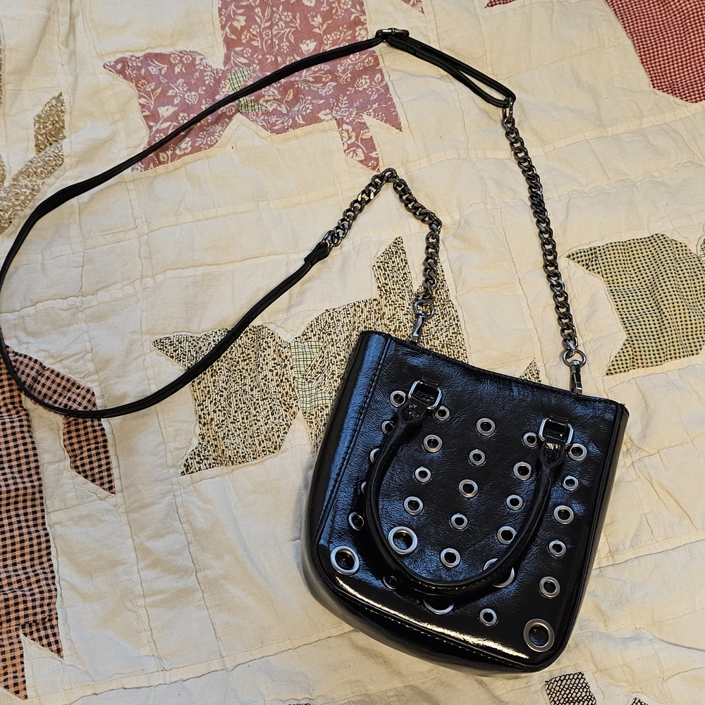 black grommet-embellished shoulder/crossbody bag